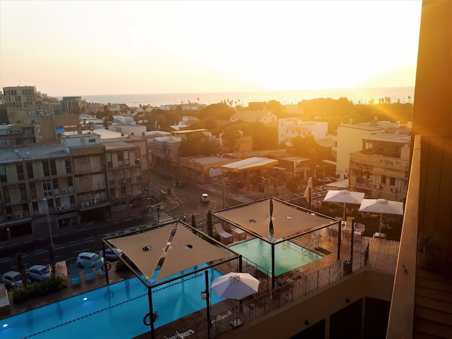 View from the apartment's balcony overlooking the ocean, two pools and the ancient port of Jaffa