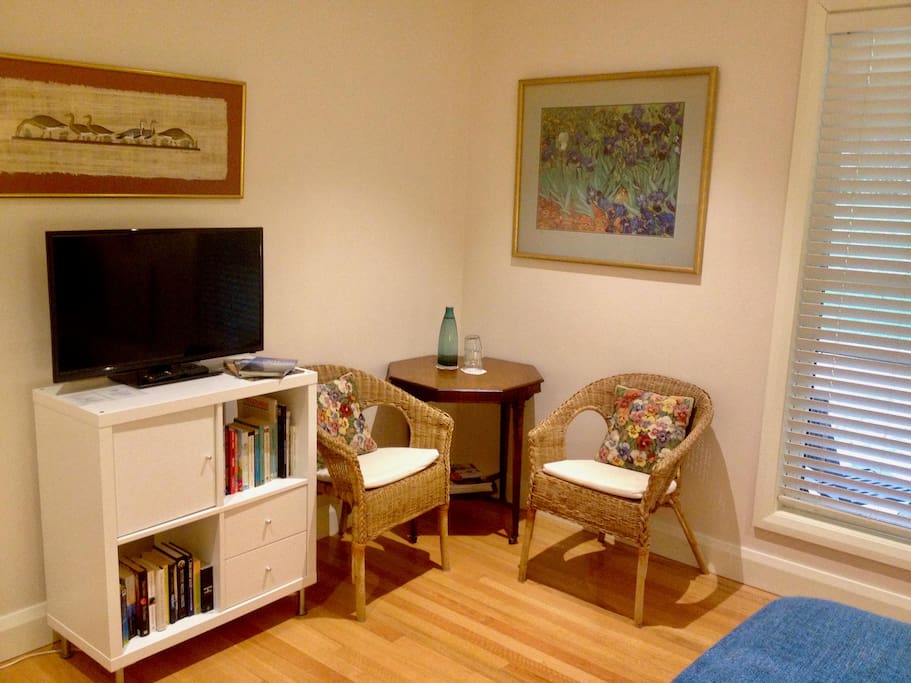 Guest bedroom - another view, TV, books, selection of DVDs.
