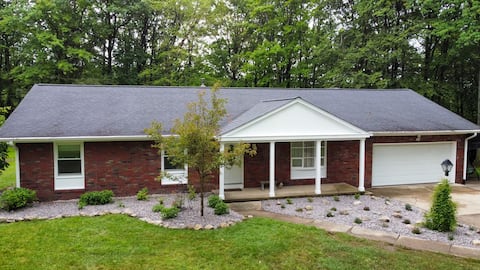 Large home with hot tub in serene wooded setting
