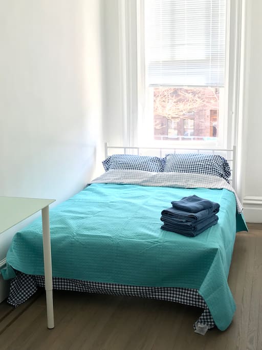 Bright room with Queen size bed with a NEW Therapeutic mattress