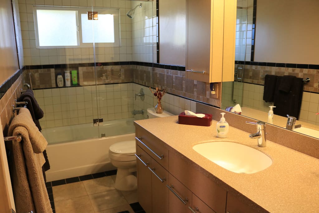 Private bathroom with tub and shower