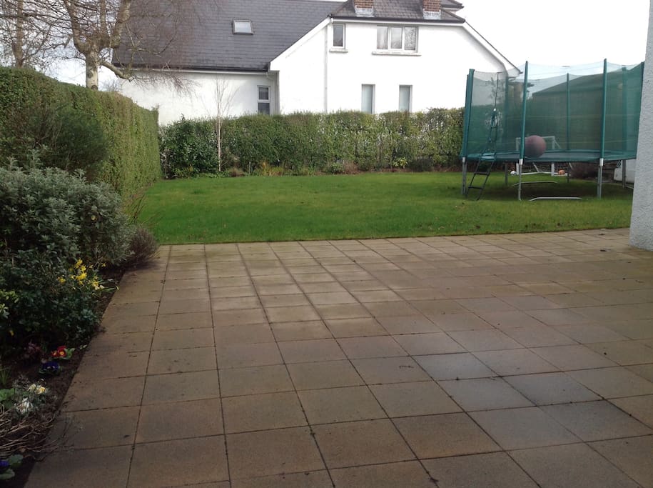 Large patio area and lawn to relax on