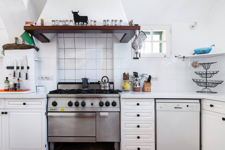 Dine Under a Towering Fig Tree at a Secluded Stone Villa gallery image 4