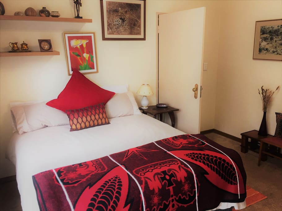 The Main Bedroom has a Queen-sized bed and is tastefully furnished.