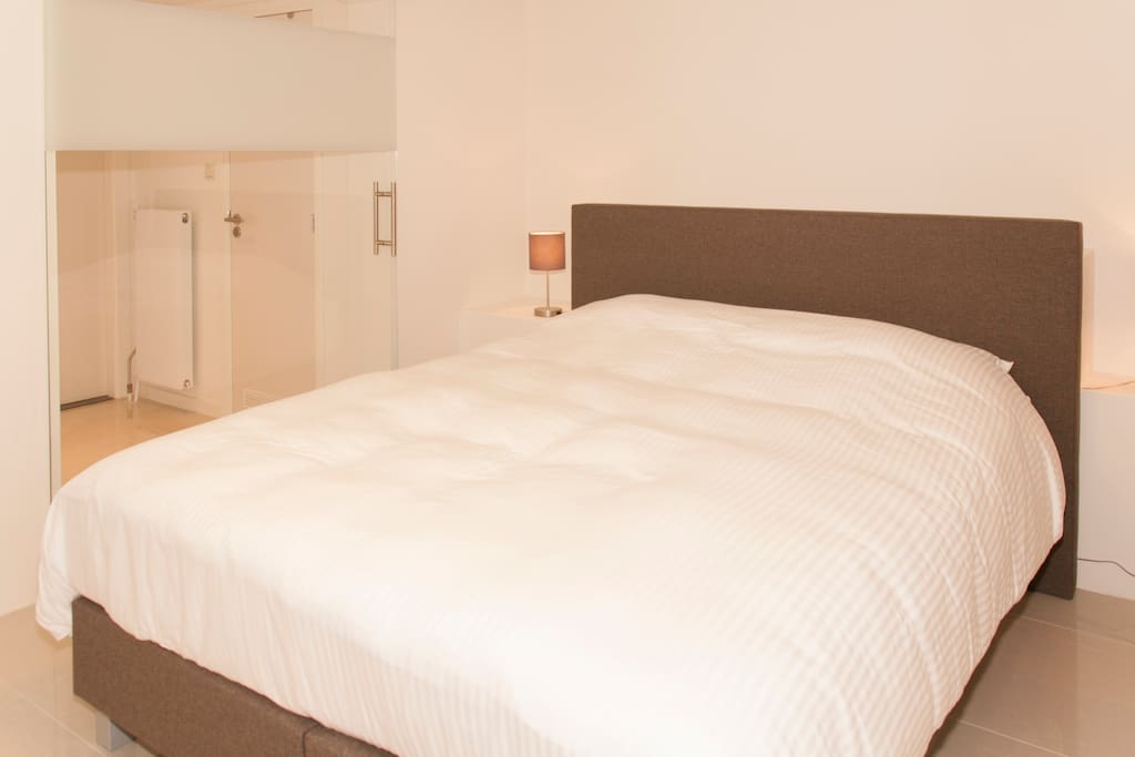 Master bedroom with kingsize bed
