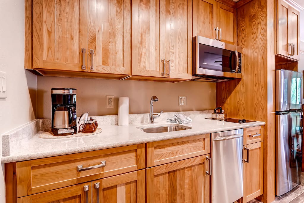 The kitchen features stainless steel appliances