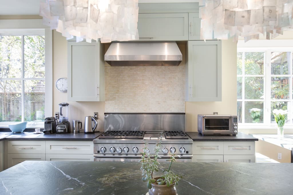 Kitchen with commercial range and appliances