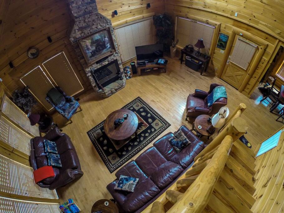 Upscale living room with cozy leather furniture, 50" smart tv, and surround sound