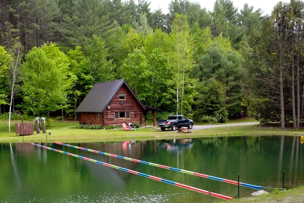 Sits on a pond, surrounded by trees. Roll out of bed and swim some laps
