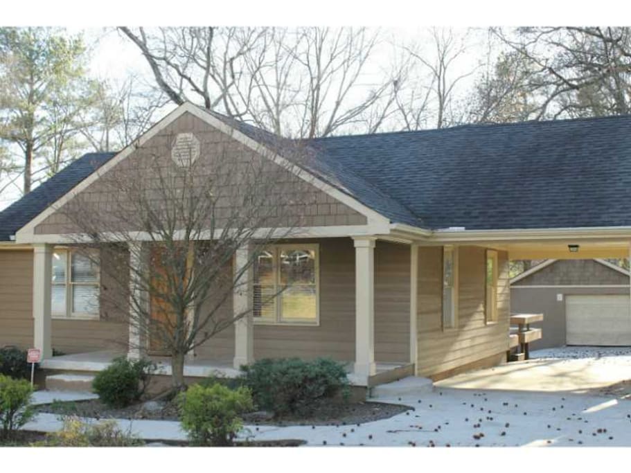 Front of house with porch and carport for covered parking