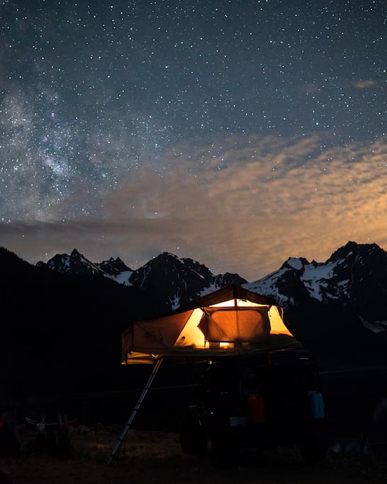 The 2-person tent is conveniently built onto the roof, giving guests great glamping views.