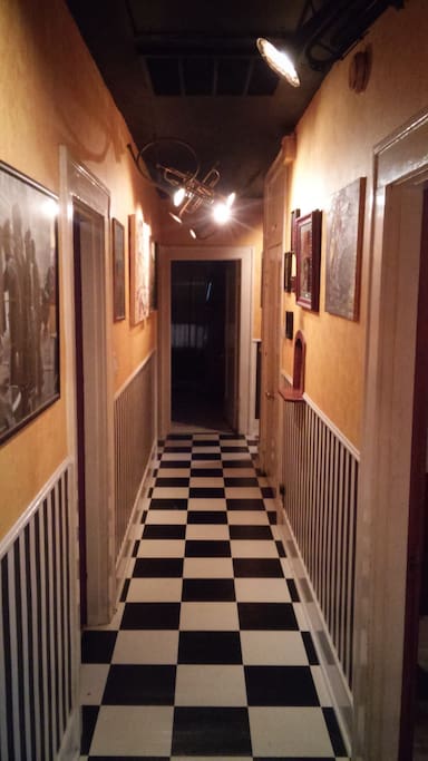 Hallway with trumpet spot lights.