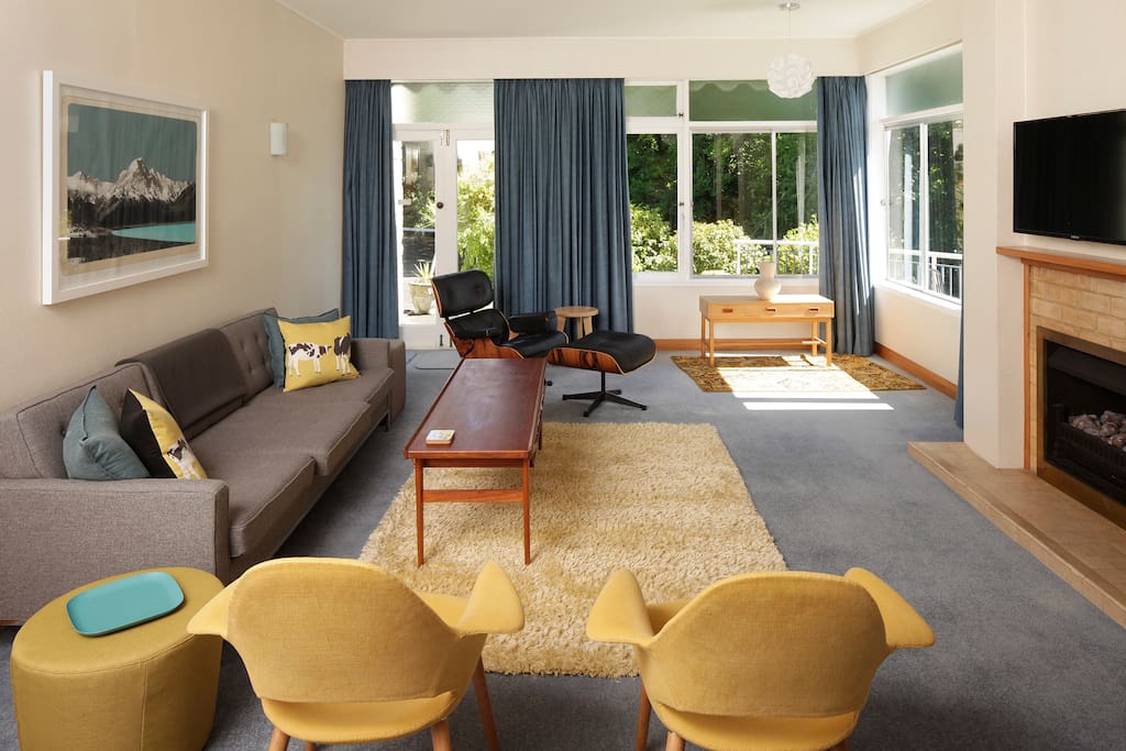 Mid-century furniture, gorgeous views, beautiful art and super host status, in this unique immaculate Whanganui bespoke home.