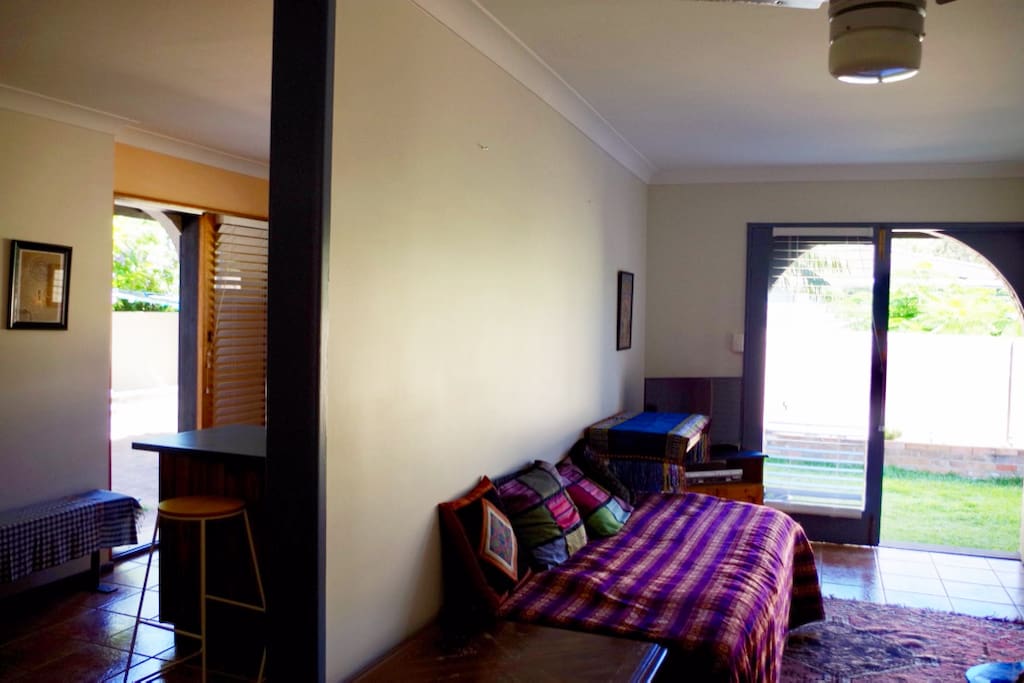 Enter through French doors into the lounge room with single bed