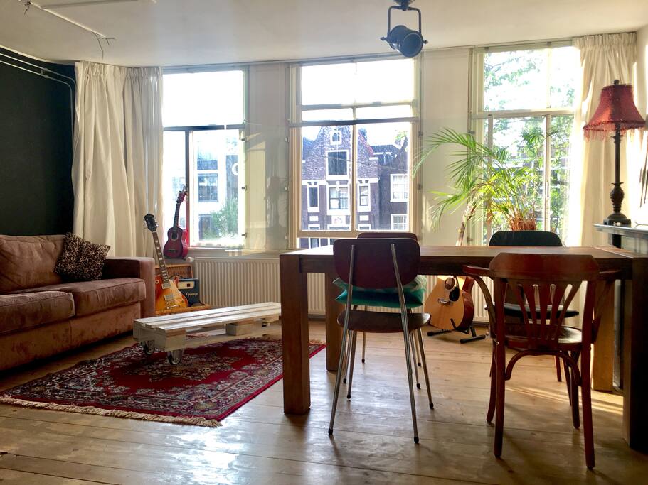 Three window living room, music and desk area