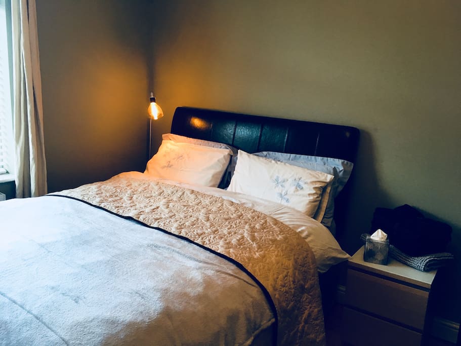 Kingsize double bed with plush duck down duvet