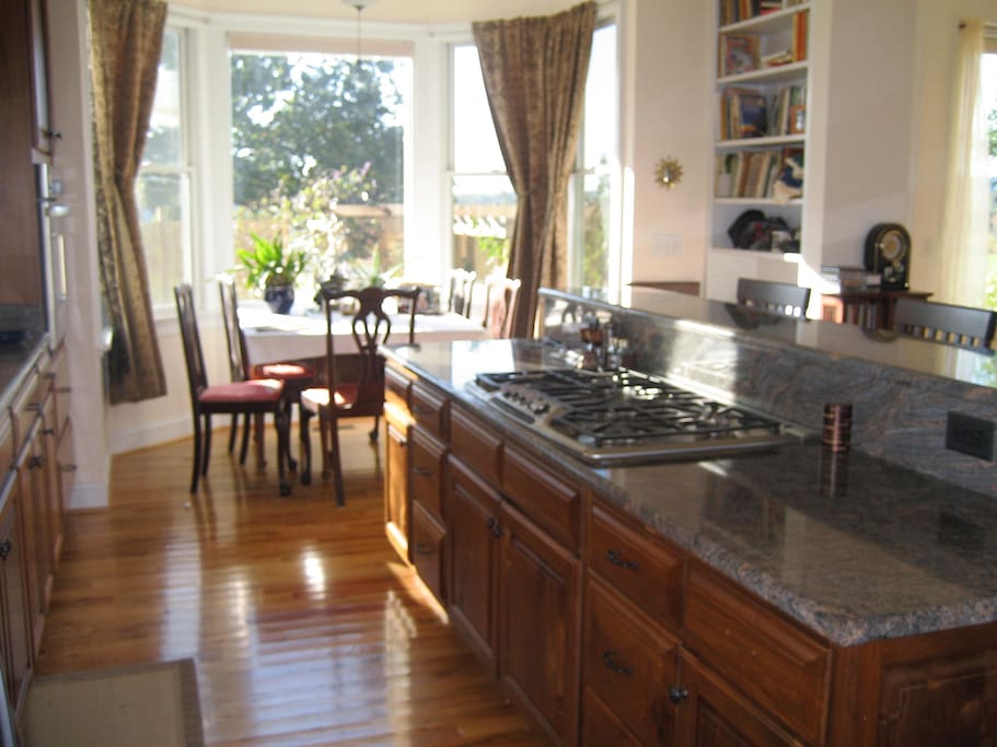 Kitchen has quiet Bosch DW, grant counters, 5 burner gas stove top, convection oven