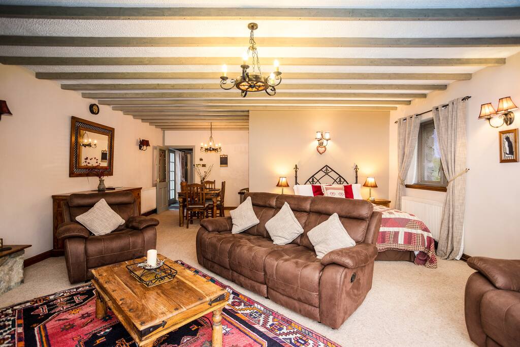Lounge seating area & dining table with double bed