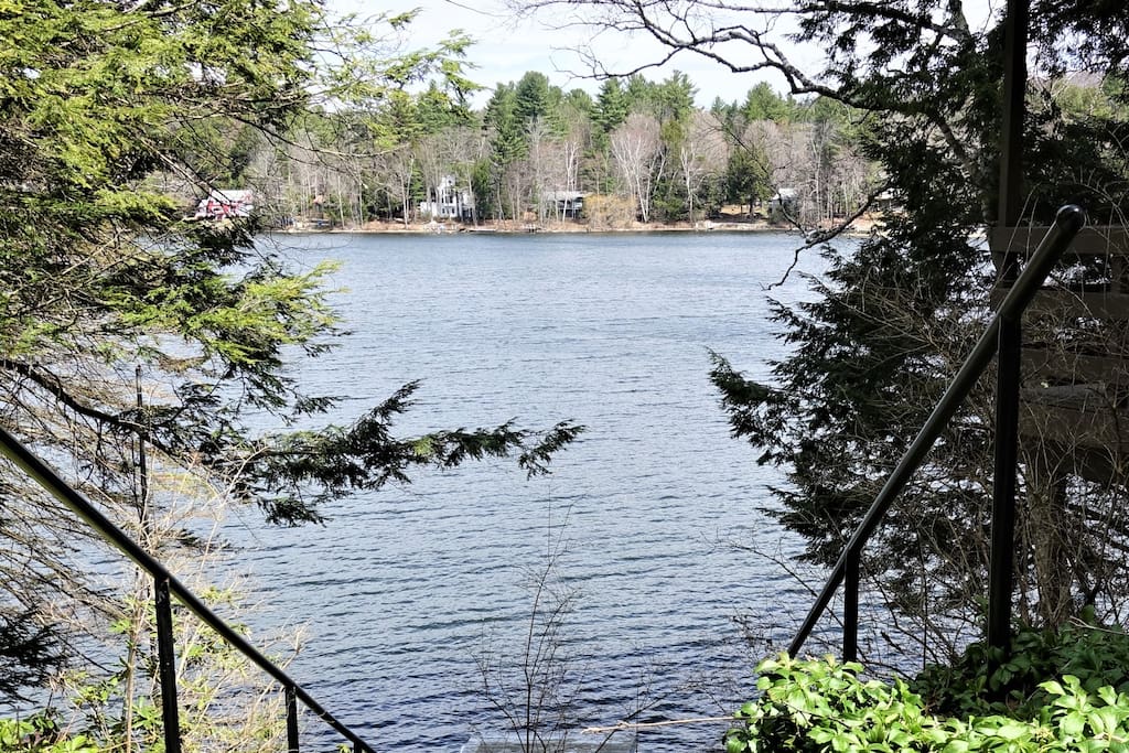 Lake view from top of steps down to first dock, walk in sandy bottom swim area