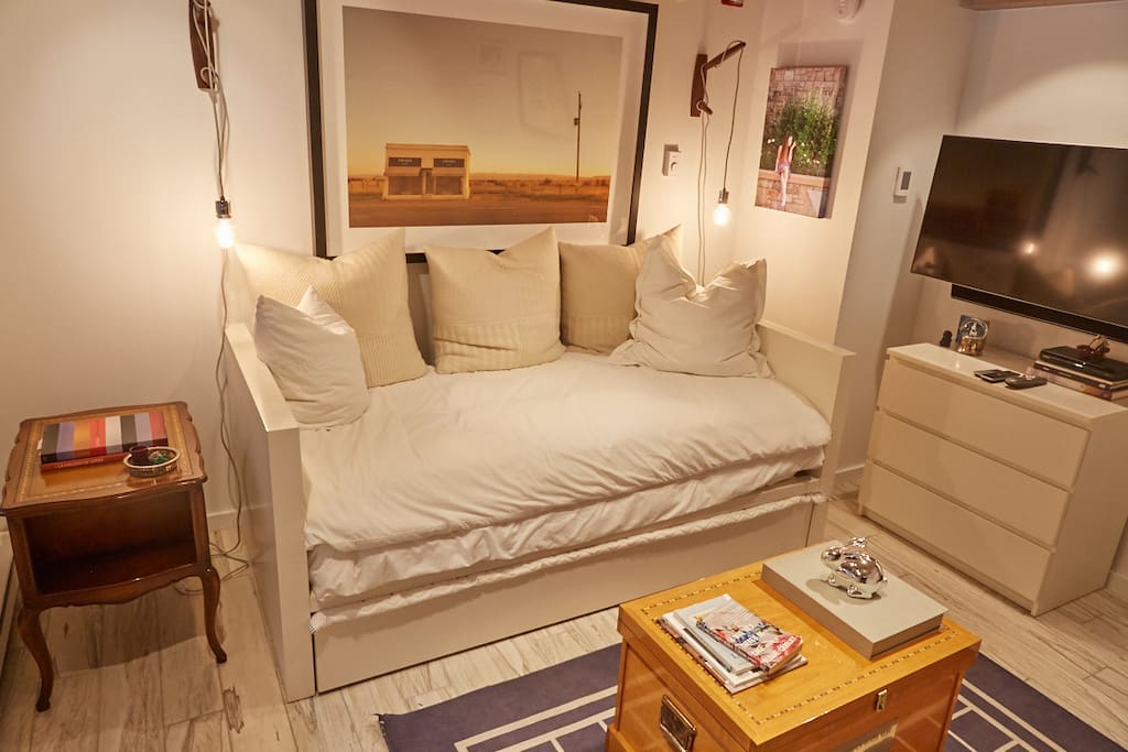 A twin-size bed plus twin trundle sleeps 2 in the main space.