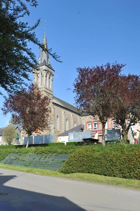 View of the village square which includes the village shop and church opposite the house