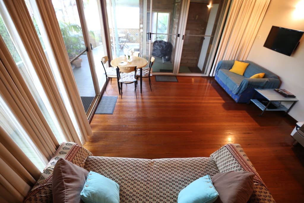 Large open, light living room overlooking the ocean and main beach.