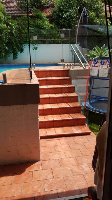 Stairs up to pool and deck area