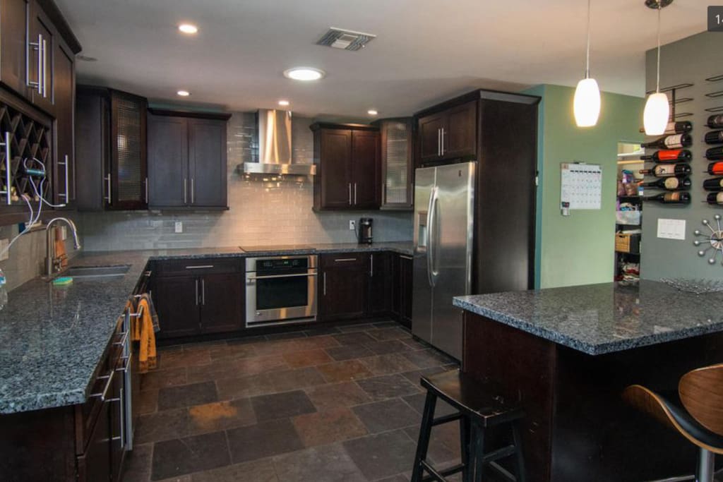 kitchen, laundry room with front loading washer and dryer