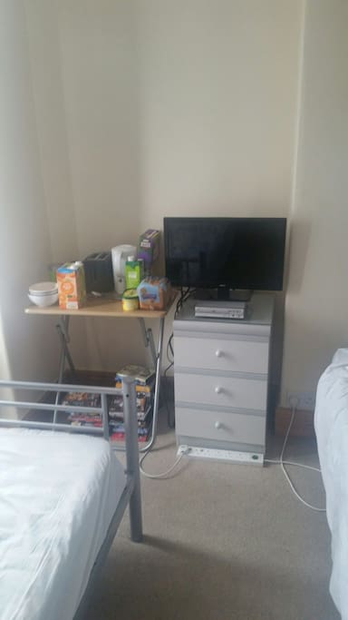 TV with DVD player and a wide range of DVDs to watch. Small breakfast table with cereal, juice, toast, tea and coffee making facilities.