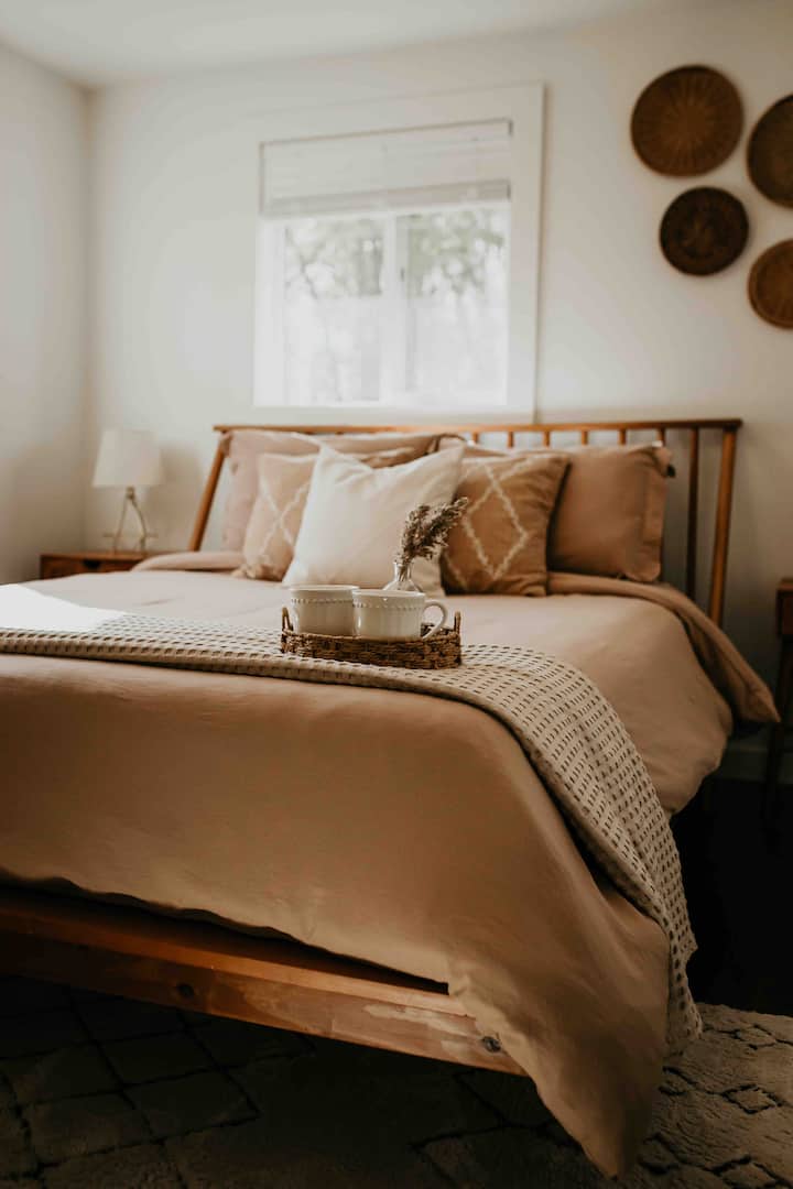 The primary bedroom has a queen bed and is the perfect place to unwind after a long day.
