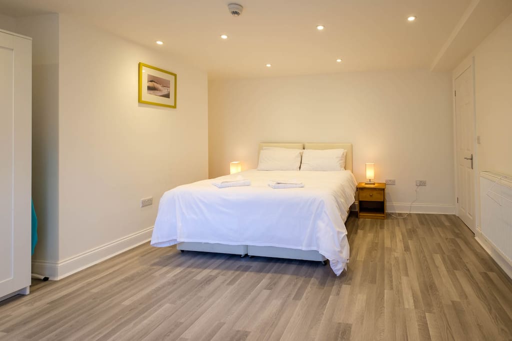 Oak-effect flooring in the master bedroom