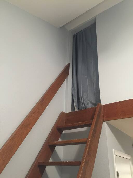 The bedroom is up the stairs in the enclosed loft.