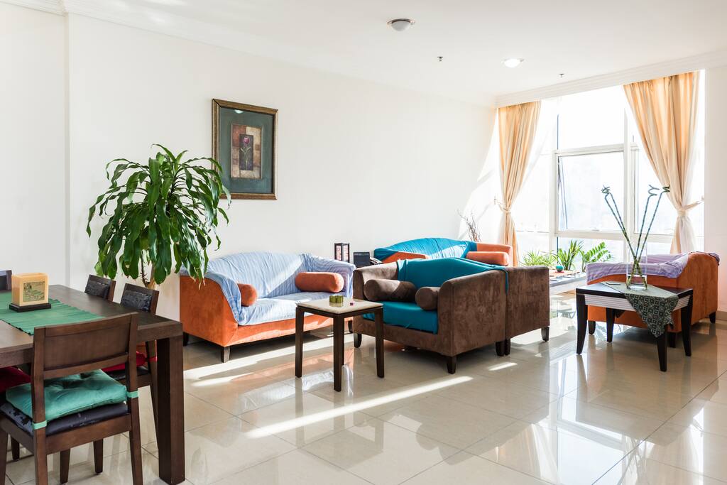The living room area enjoys a lot of light and open space.