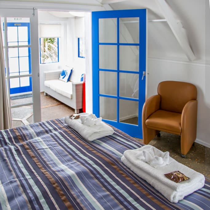 "Eros" bedroom 1, King bed and sunroom.