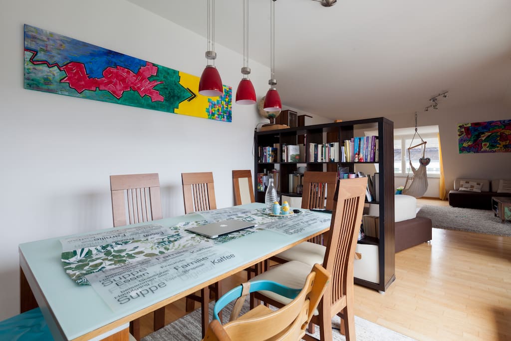 Dining table in front of balcony with adjustable lighting