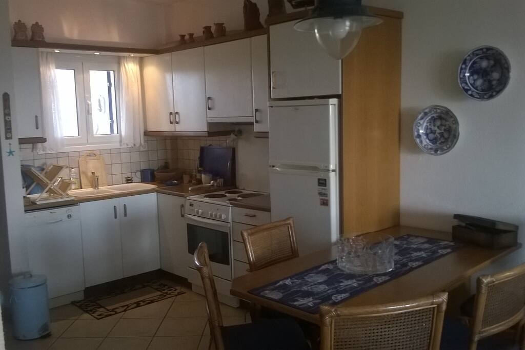 The kitchen provides all the necessary amenities. Electrical cooker, washing machine for dishes, fridge, dining table, full sets of dishes, glasses, forks, knives, spoons, etc.