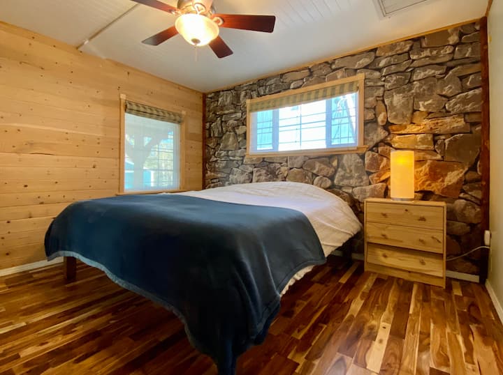 The bedroom features a large king bed