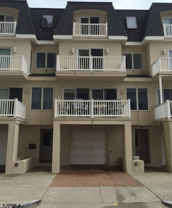 Beautiful town house with three sea view balconies. It has two car garage and an additional car parking space in the driveway.