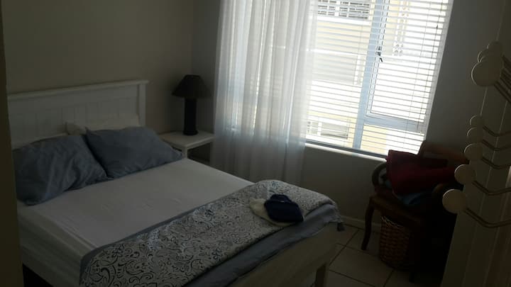 Main bedroom with a double bed, overlooking the quarry.