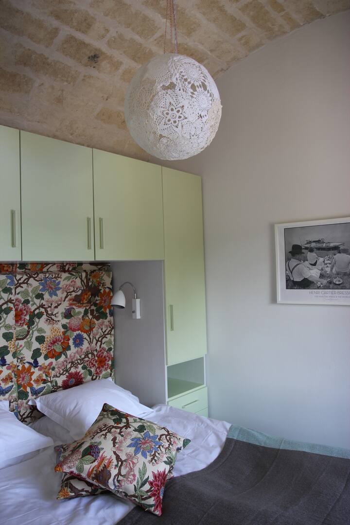 The green bedroom with access to bathroom