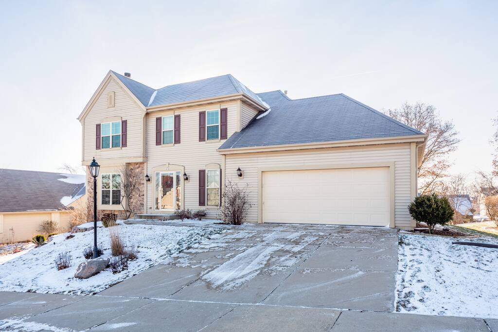 House is in a quiet suburban Waukesha neighborhood on a hill.