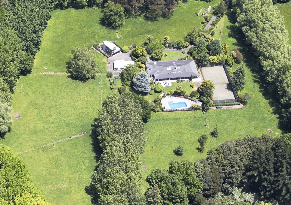 Aerial view of Property, Studio is located above the garage top left of photo