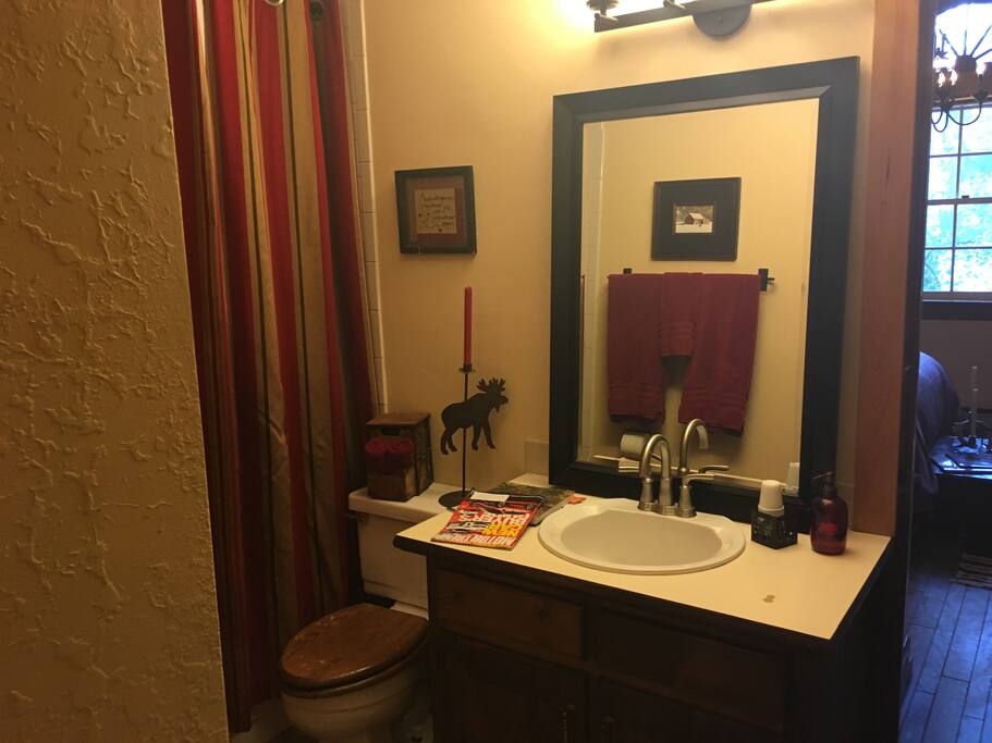 Adjoining bath with shower and sauna.