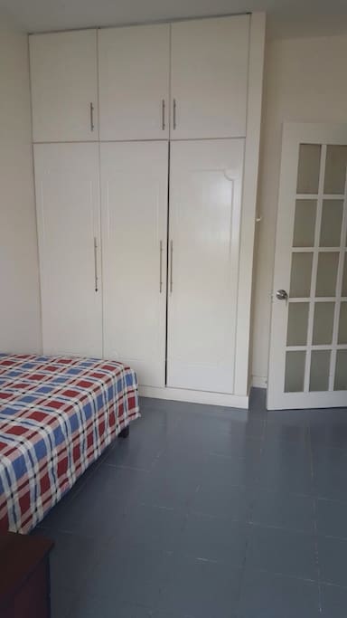 Your comfy bedroom with a non-Asian mattress. It's soft and has real springs! You'll be greeted with fresh linens and towel.
