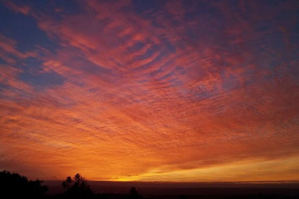 Wake up early for sunrise over the hills