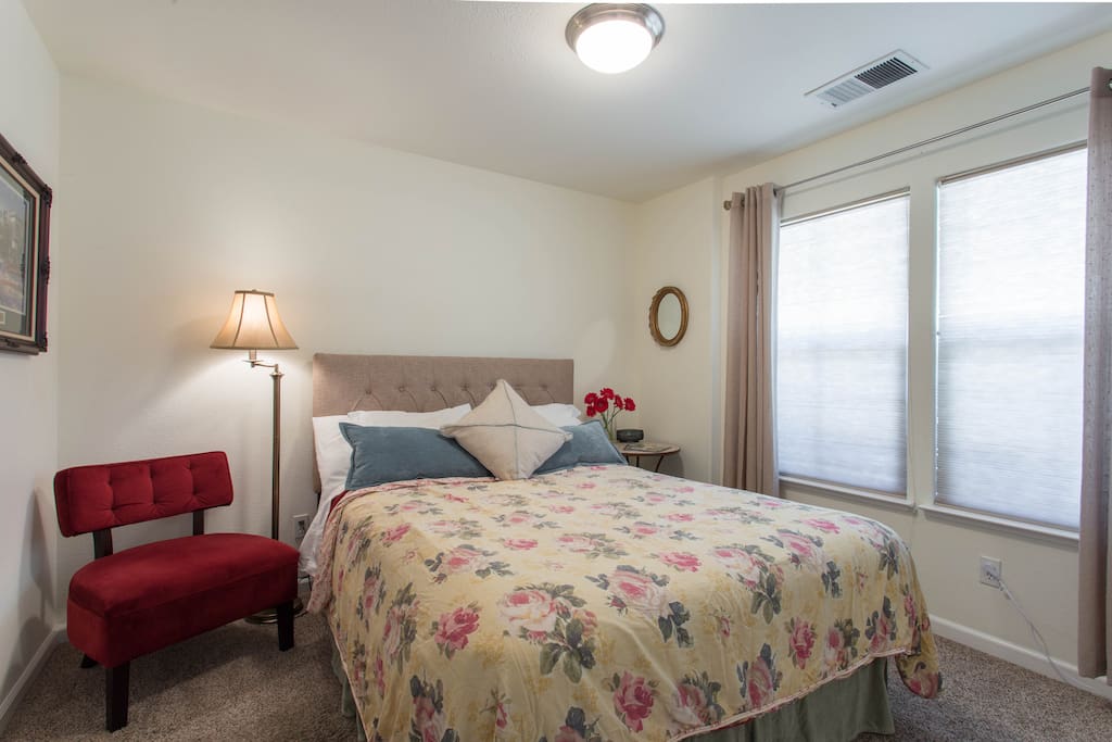Bright sunny room with clean comfortable bed