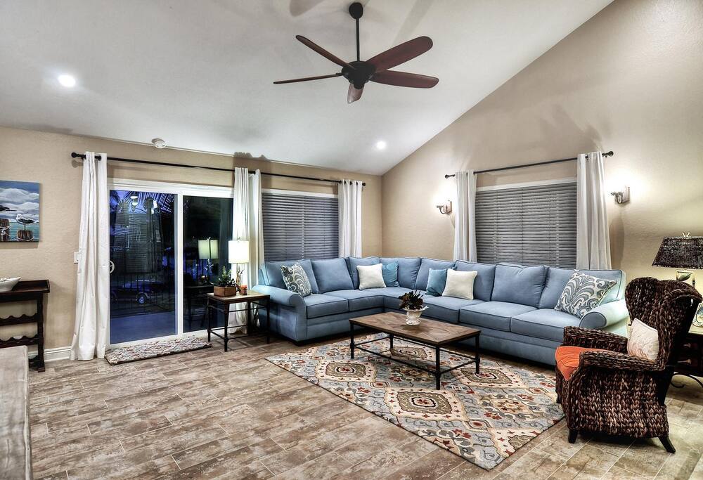 Living room has a brand new queen size sleeper sofa.