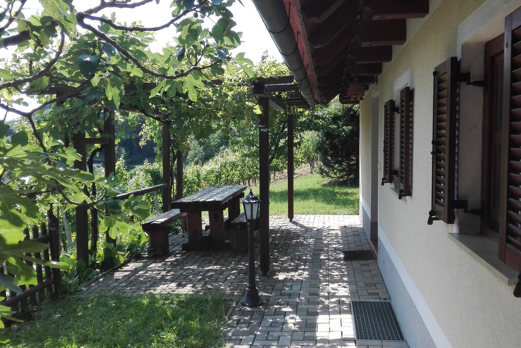 Terrace with a view on forest and valley bellow the hill