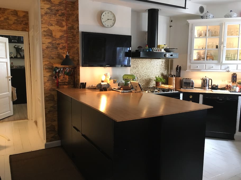 Tv with Apple TV in kitchen/living room