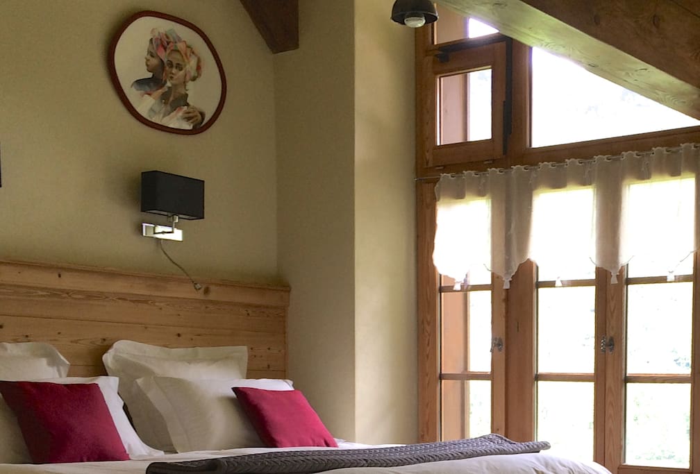 L'Atelier king double with art studio window looking down Abondance valley